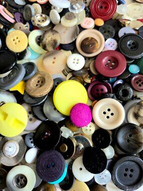 Lot of vintage buttons various sizes and colors.
